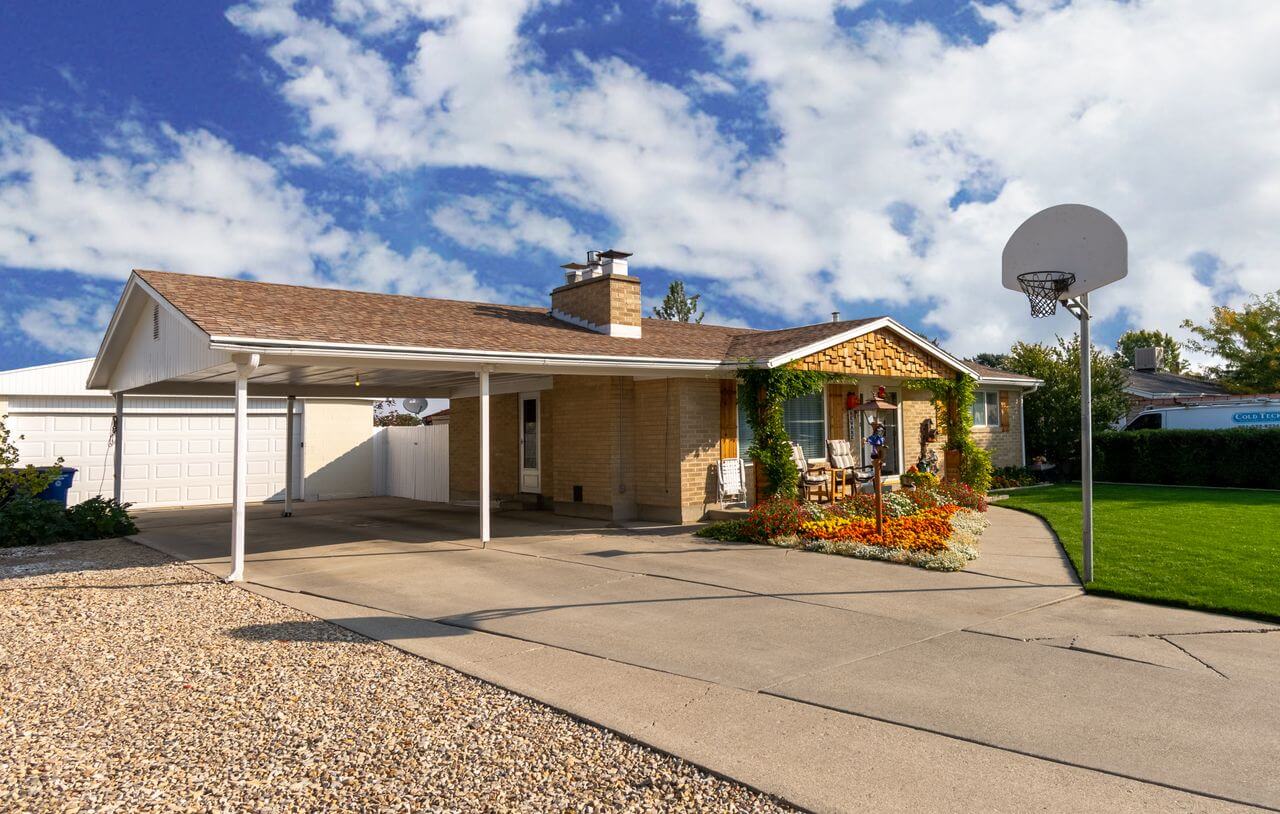 Exterior view of a ranch-style home and driveway with a garage-top ADU in Highlands Ranch, Colorado one year after completion.